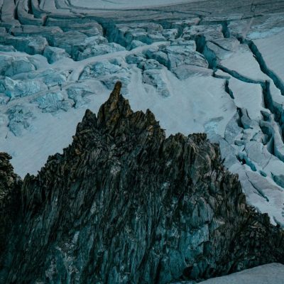 Beautiful shot of snowy and rocky steep mountains and hills Beautiful shot of snowy and rocky steep mountains and hills